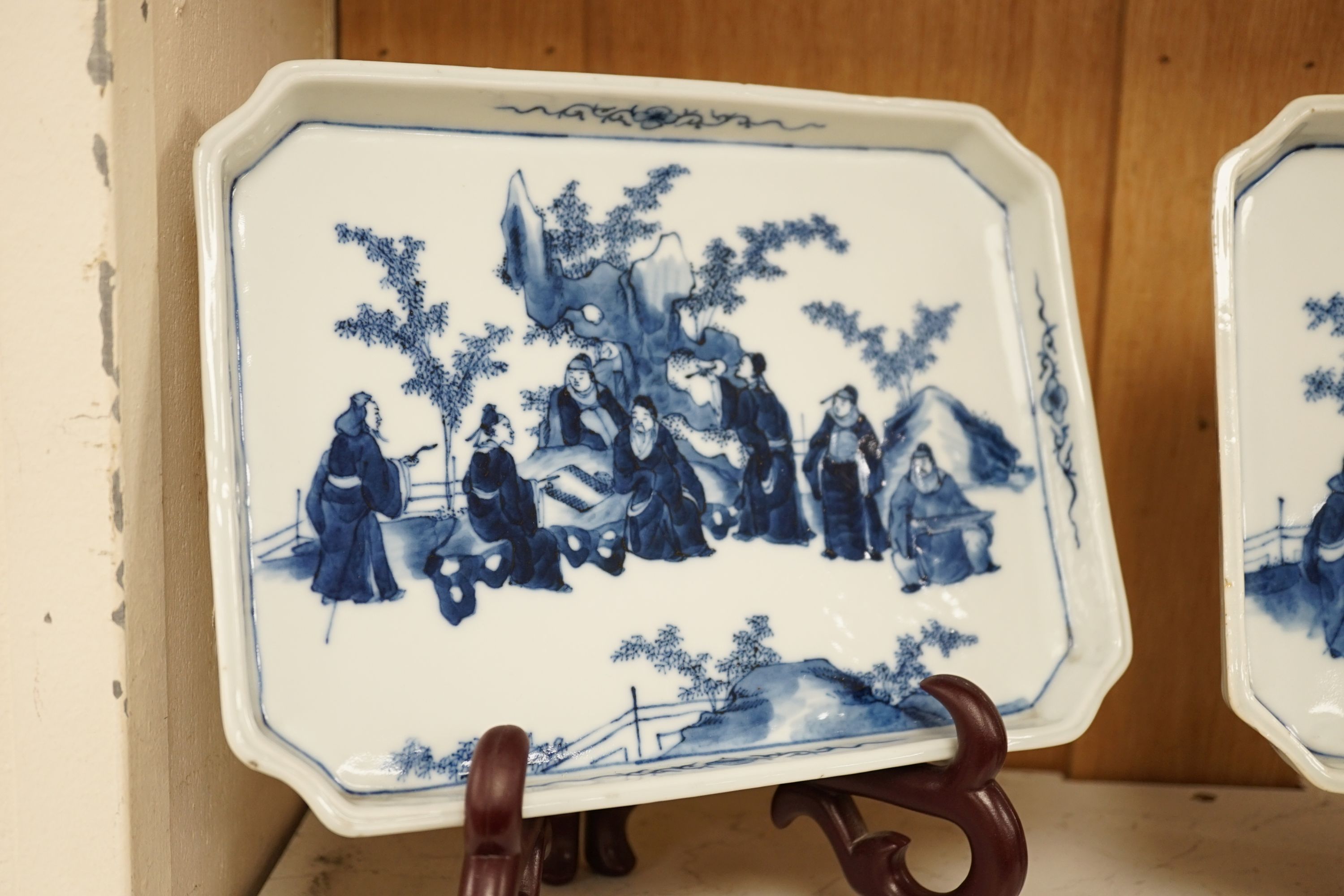 A pair of 19th century Chinese blue and white ‘Seven Sages of the bamboo grove’ dishes, 23.5cm long